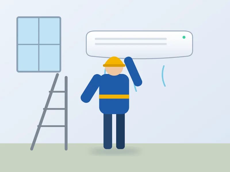 Técnico instalando un aire acondicionado split en la pared